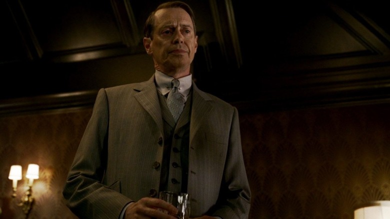 nucky holding a drink