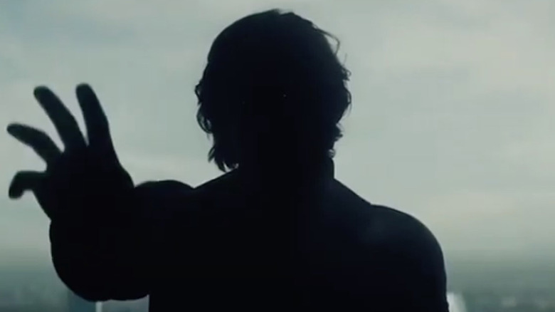 The Void with his hand reaching out in 