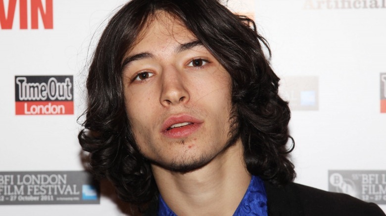 Ezra Miller posing at a premiere