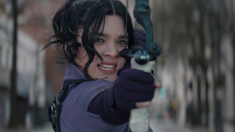 Kate aims her bow.