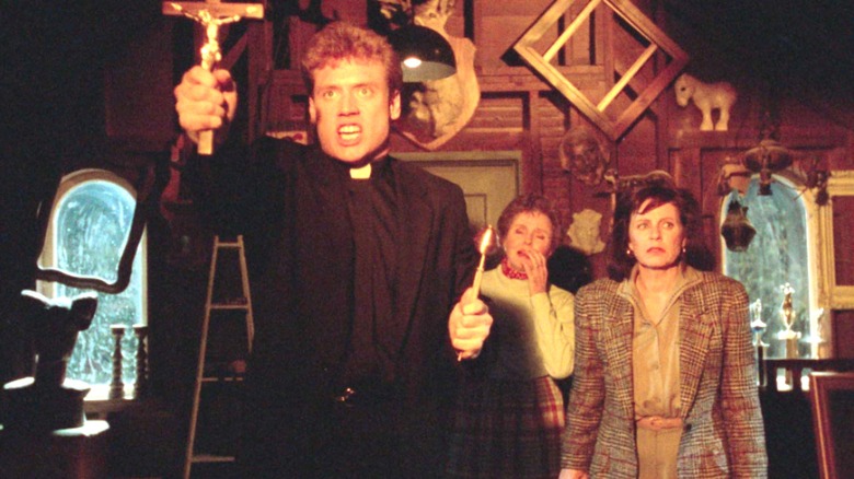 A priest defies evil spirits