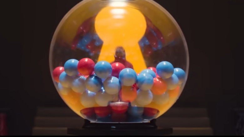 A prize machine full of red and blue balls in "Squid Game" (2021-2025)