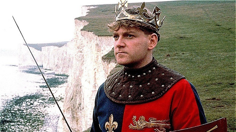 Kenneth Branagh in front of cliffs
