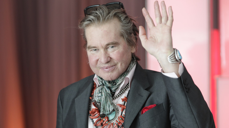 Val Kilmer waving on the red carpet